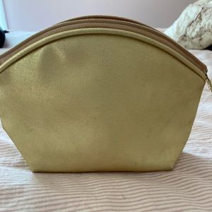 Small golden makeup bag